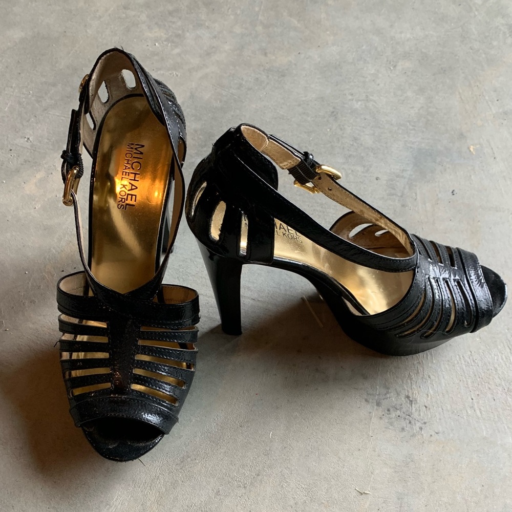 Michael Kors Black Leather Platforms. Size 7.5. Gold hardware. Lightly used.